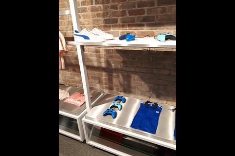 The Experience Zone features Xbox consoles for shoppers to use, with branded apparel and colour-coded Xbox handsets around the perimeter.